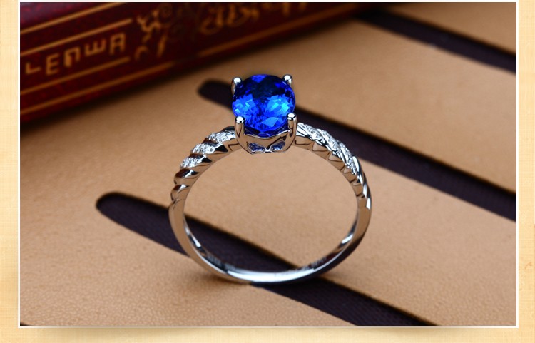 1 Carat Sapphire and Diamond Halo Engagement Ring in White Gold